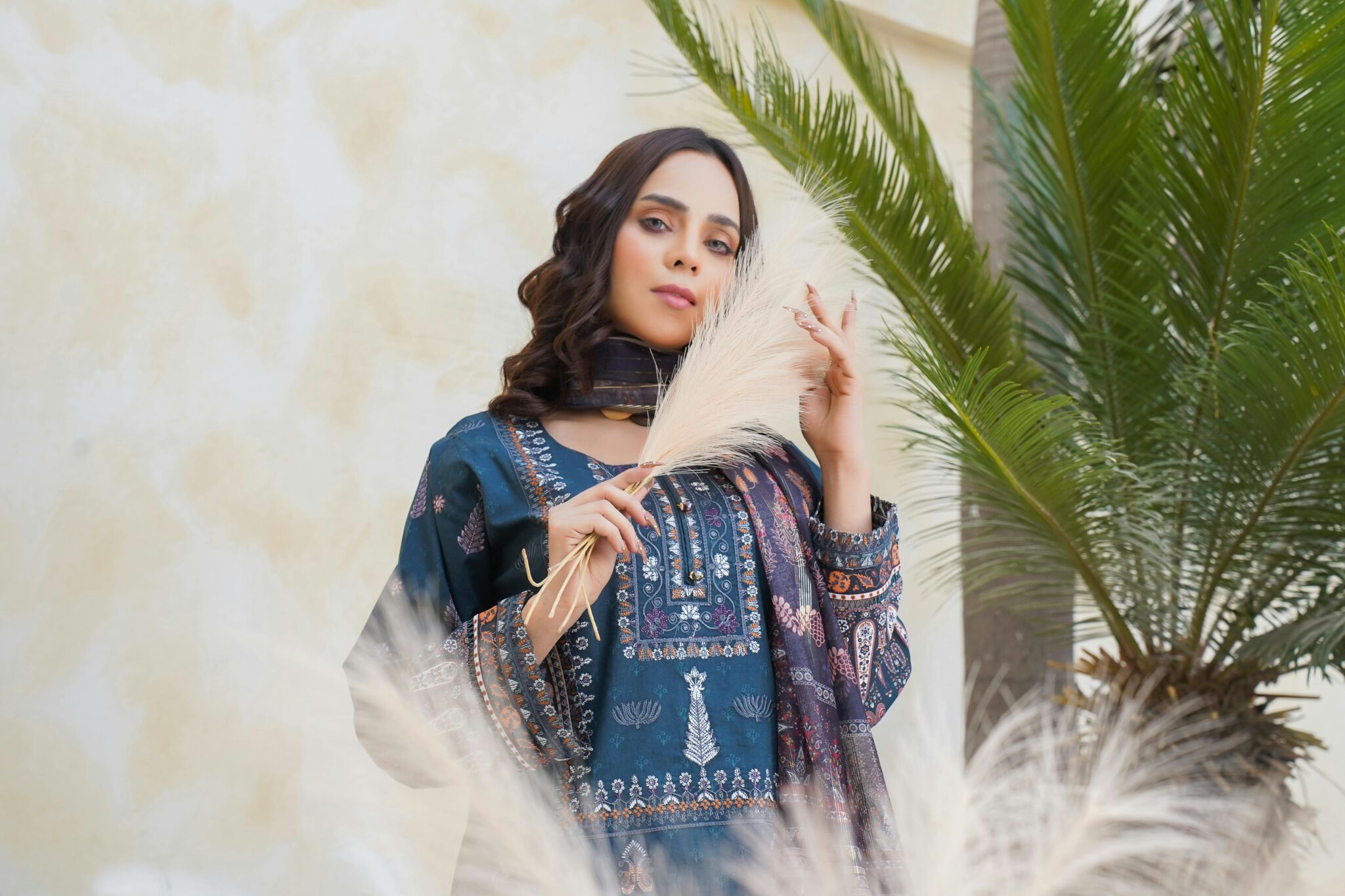 Elegant Pakistani fashion portrait featuring a model outdoors in Lahore.